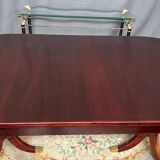 Empire style dining table with two sliding elements.