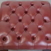 In very good condition elegant red/brown chesterfield ottoman made of cow leather