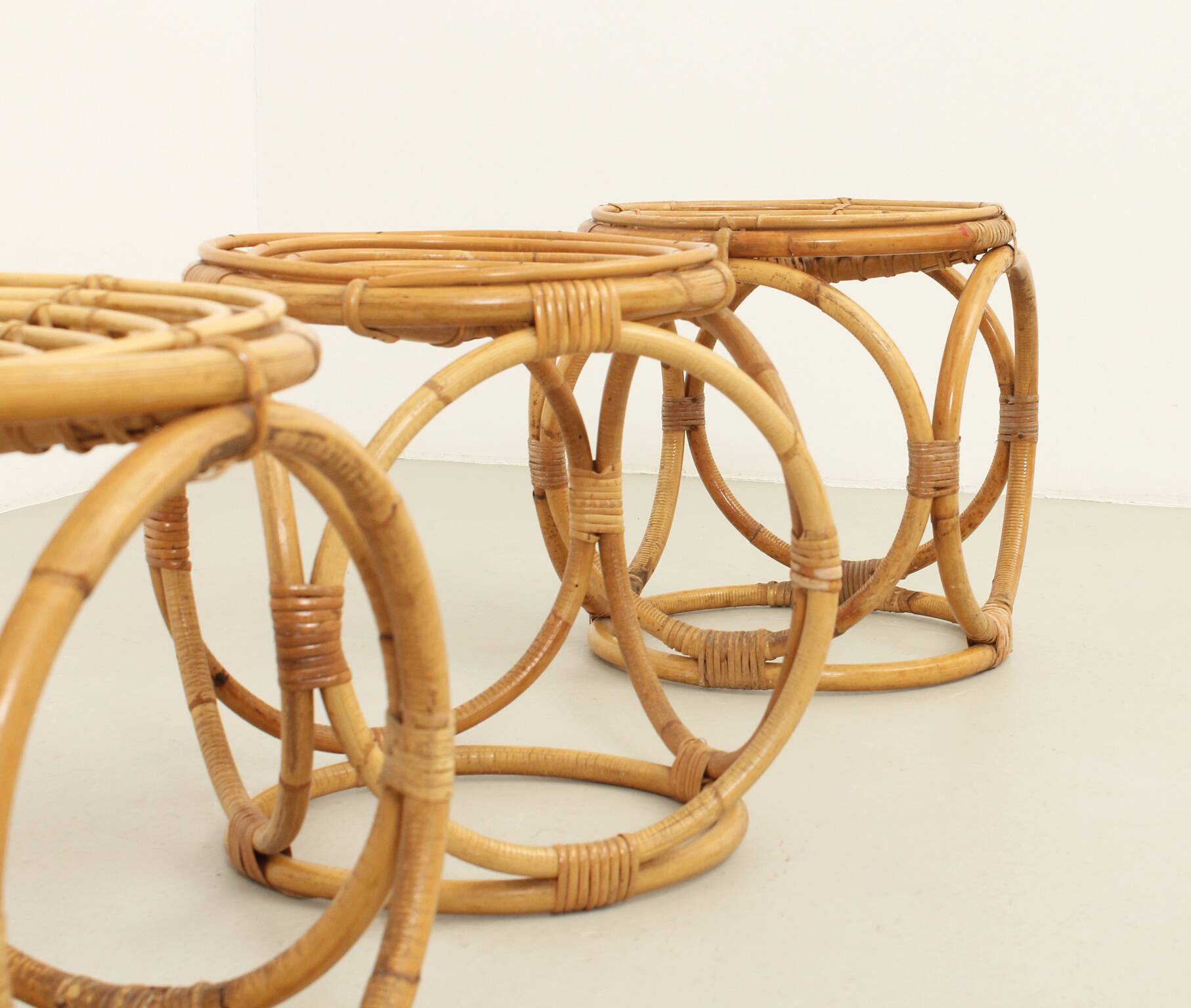 Set of three 1970s rattan stools, Spain.