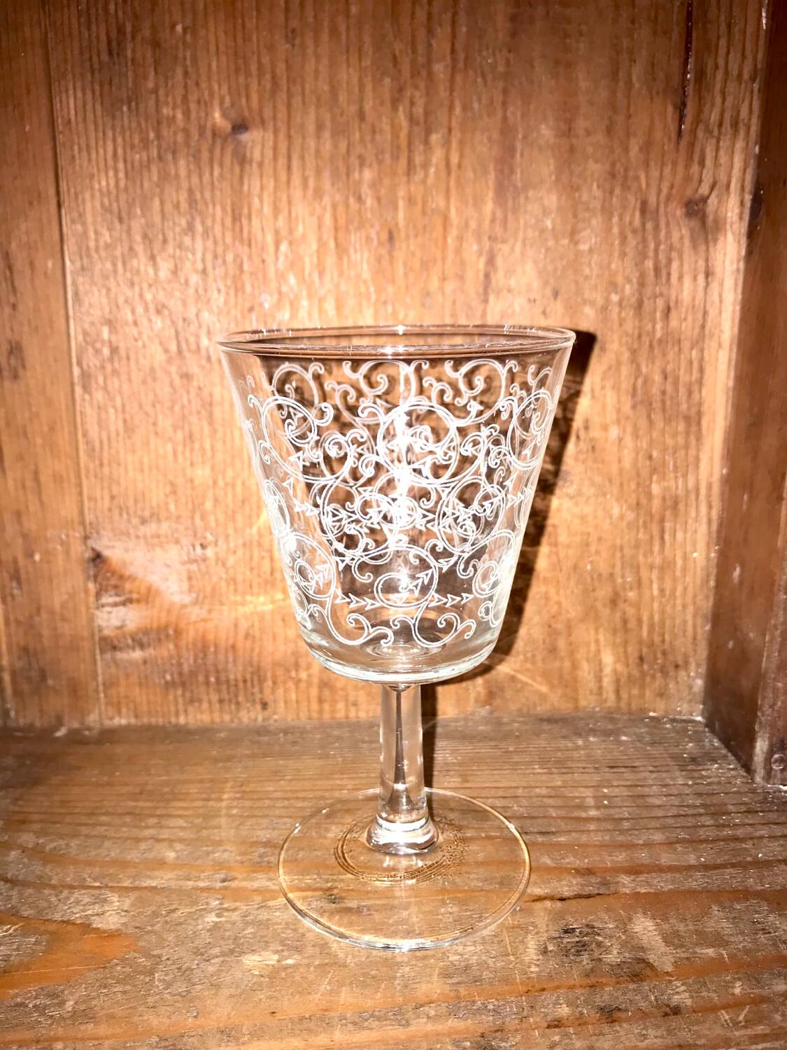 Set of old glasses with white arabesque pattern