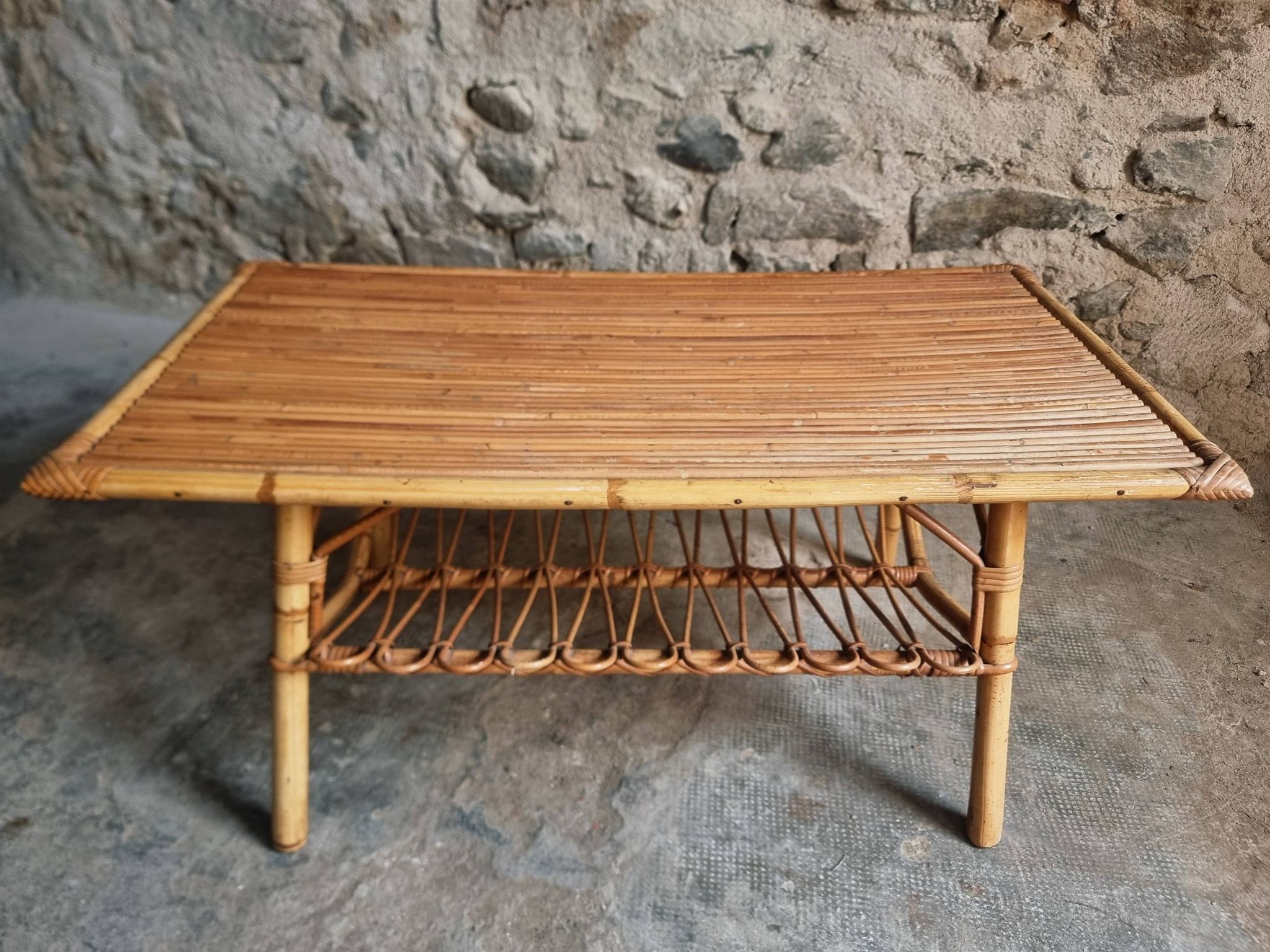 Vintage bamboo and rattan coffee table with magazine rack, French, circa 1960–1970.