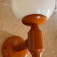 Vintage wooden globe wall light in white glass