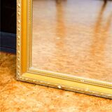 Vintage rectangular gilt mirror, molded wooden frame with beads and fire