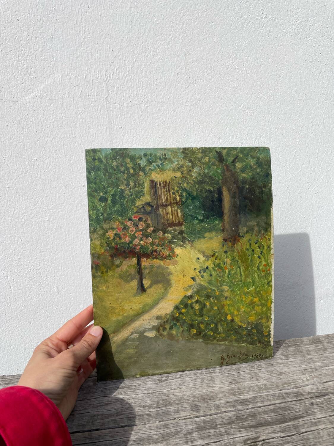 Paysage jardin à l’huile signé