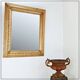 Large gilded wood and stucco mirror with foliage