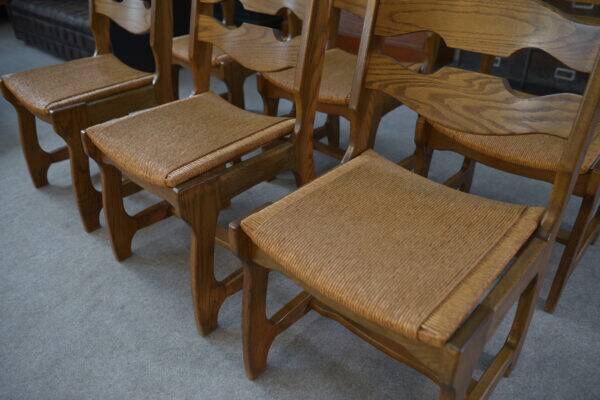 Set of 6 oak dining chairs with rush seat and 'Echelle' backrest in the style of Guillerme et Chambron 1950s