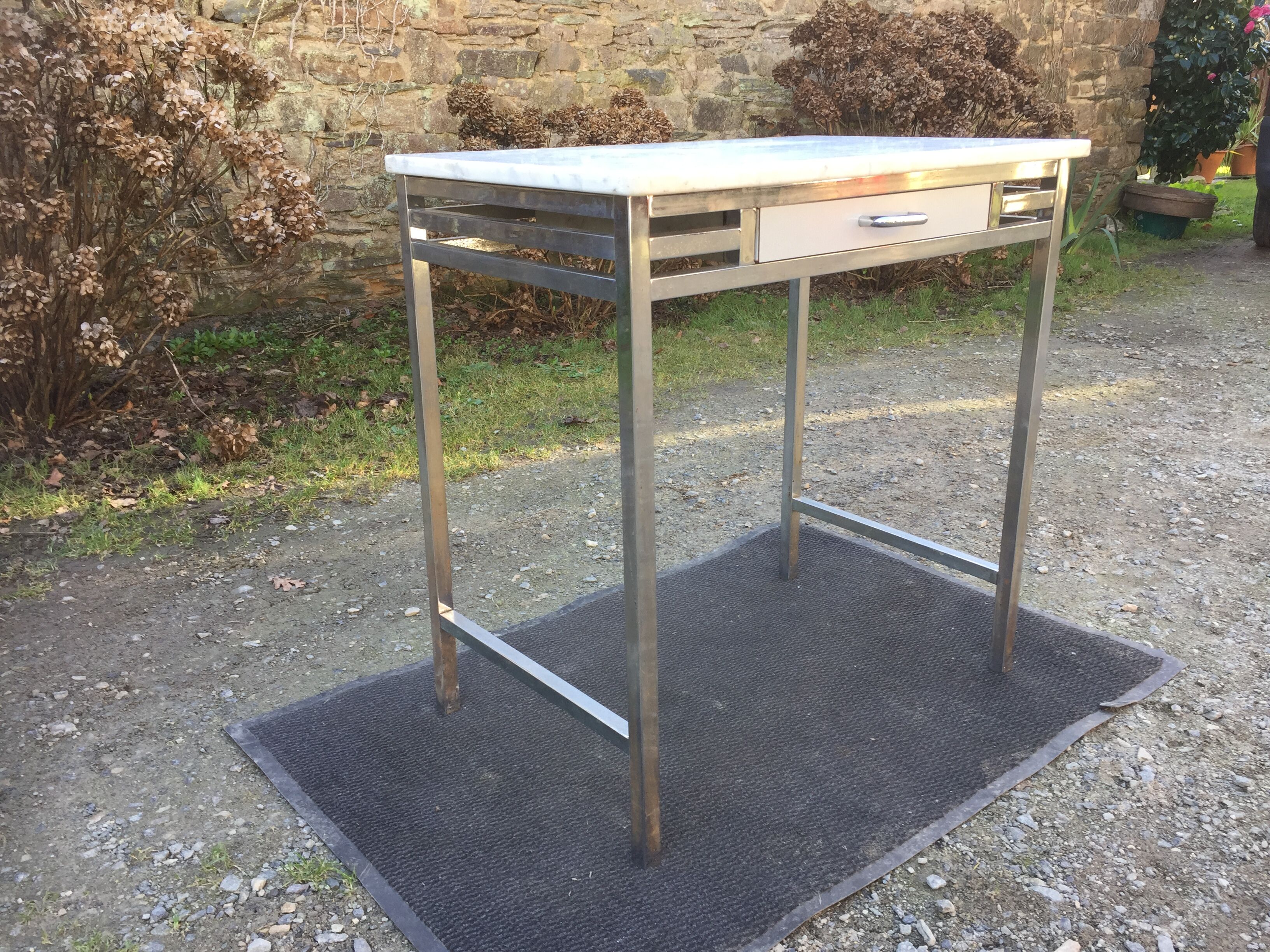 Vintage table with square chrome tubular metal base and marble top.