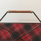 Magazine rack in black lacquered metal, leather and checkered fabric