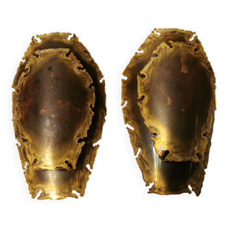 A set of beautiful brutalist wall lamps in flame-cut brass