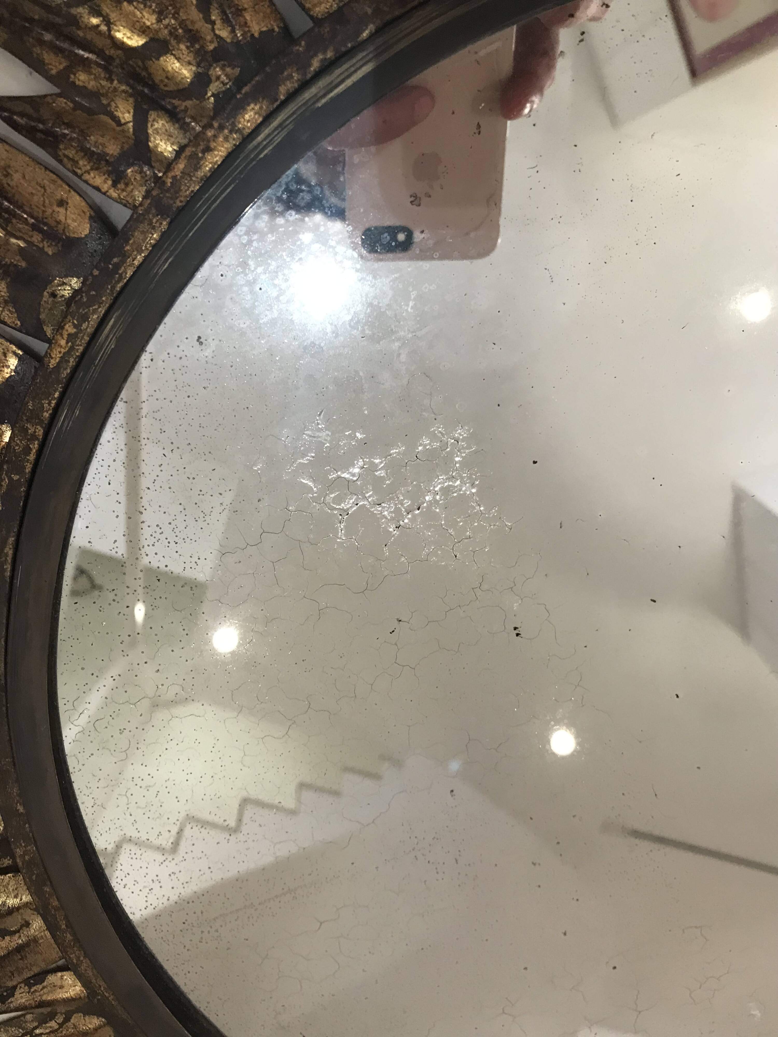 Sun mirror decorated with golden leaves, circa 1950.