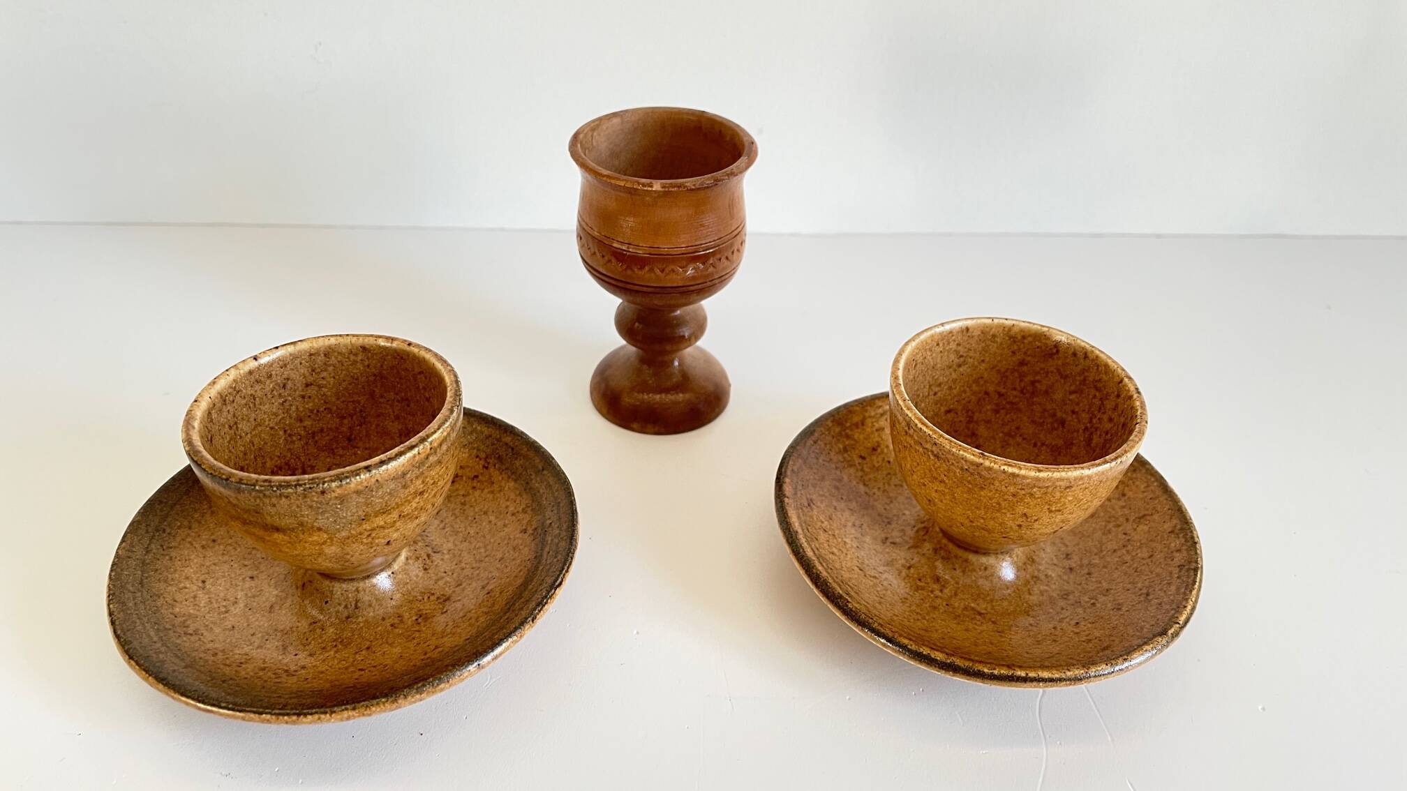 Trio of vintage ceramic and wood egg cups