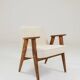 Vintage armchair with rustic wood and beige bouclé design by Chierowsky.