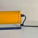 Adjustable wall lamp in yellow and blue.