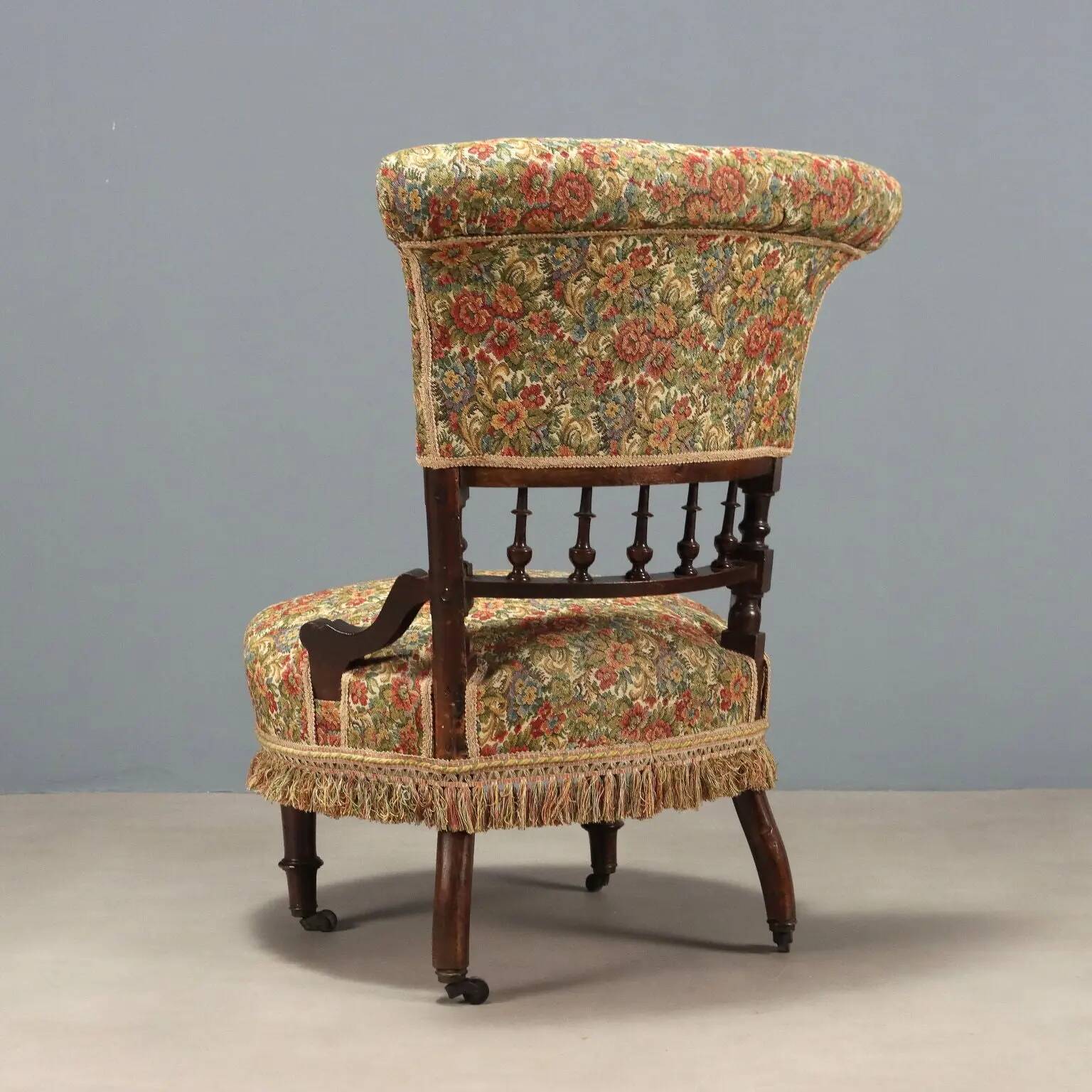 Victorian armchair with fabric pouf, England, 19th century.
