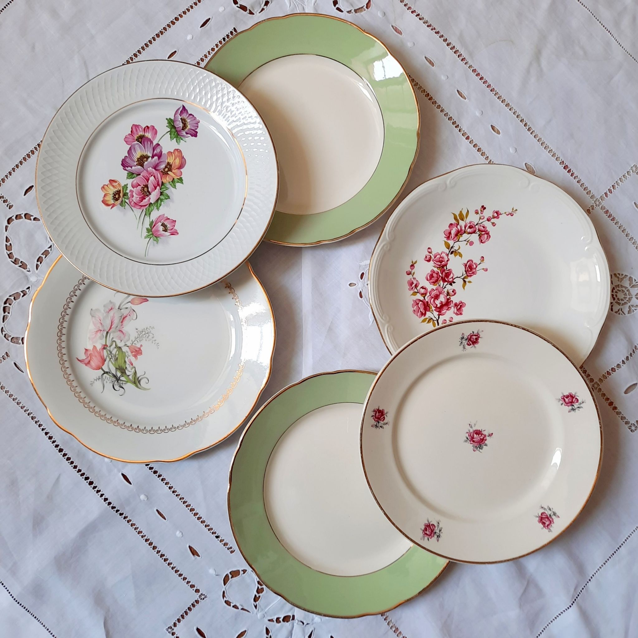 Flat antique earthenware plates with gilded edges