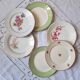 Flat antique earthenware plates with gilded edges