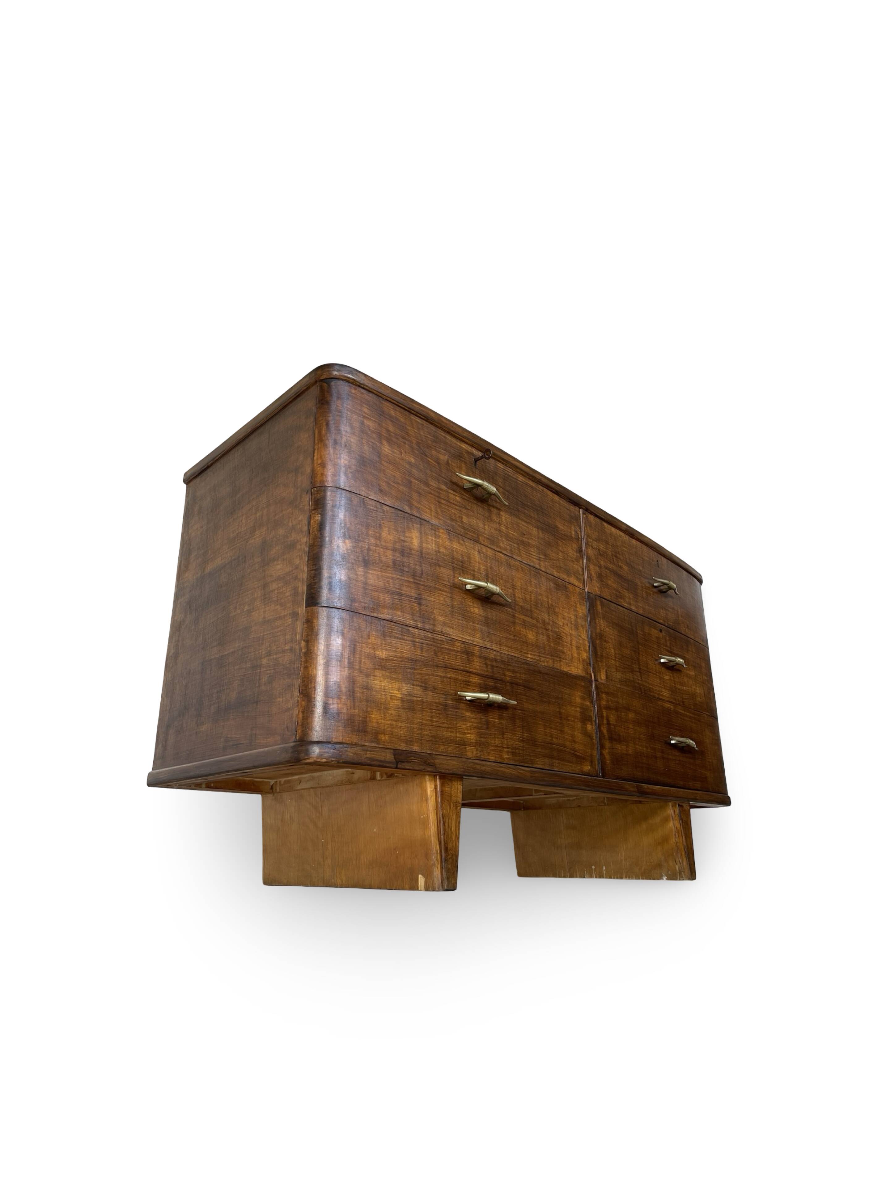 A vintage Italian chest of drawers, made of veneered walnut and solid wood,