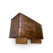 A vintage Italian chest of drawers, made of veneered walnut and solid wood,