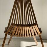 Foldable designer armchair in wooden slats