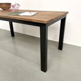 Solid oak dining table from the 70s with metal legs