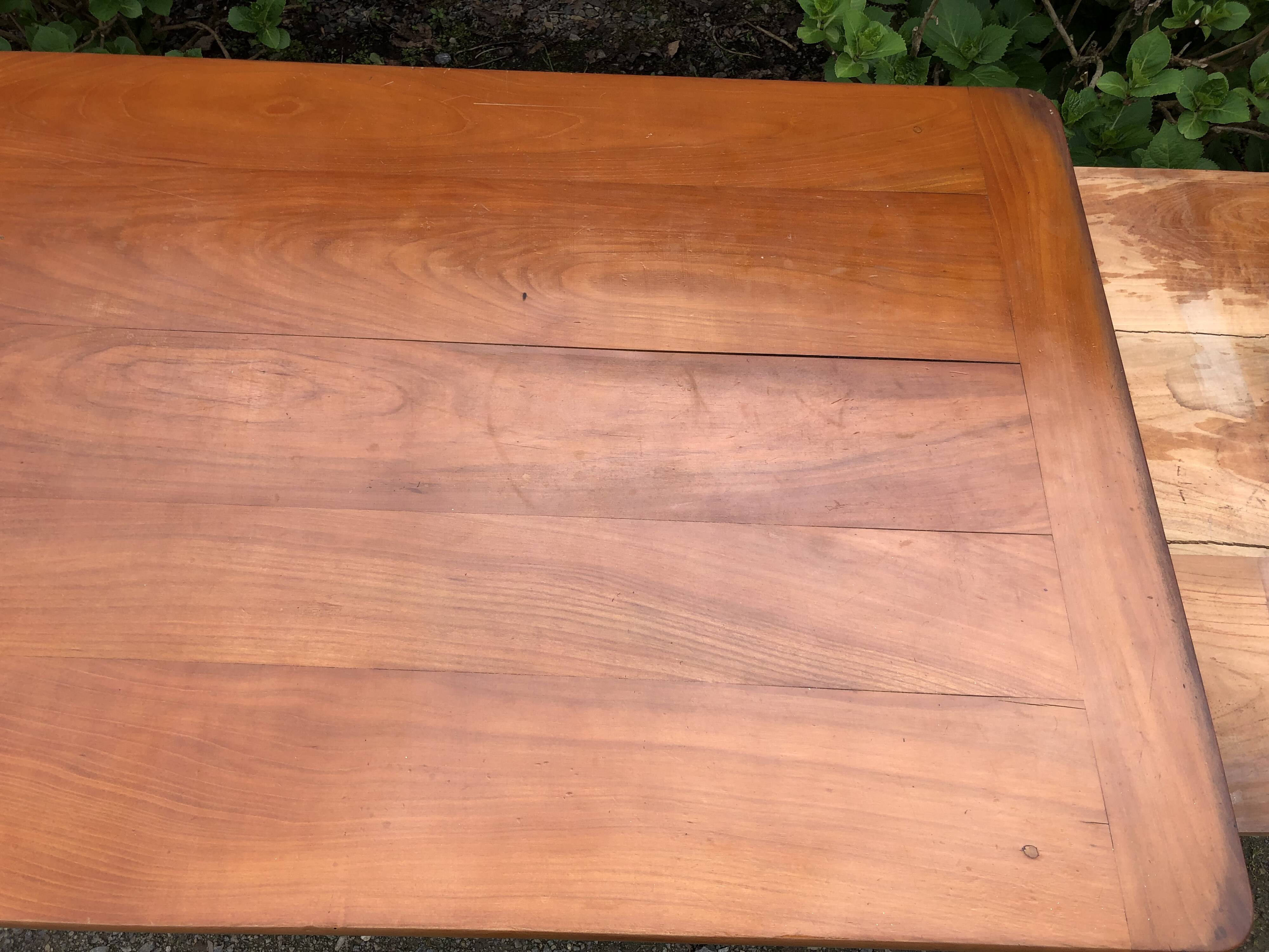 Antique Louis Philippe style farmhouse table in solid cherry wood with its 2 extensions.