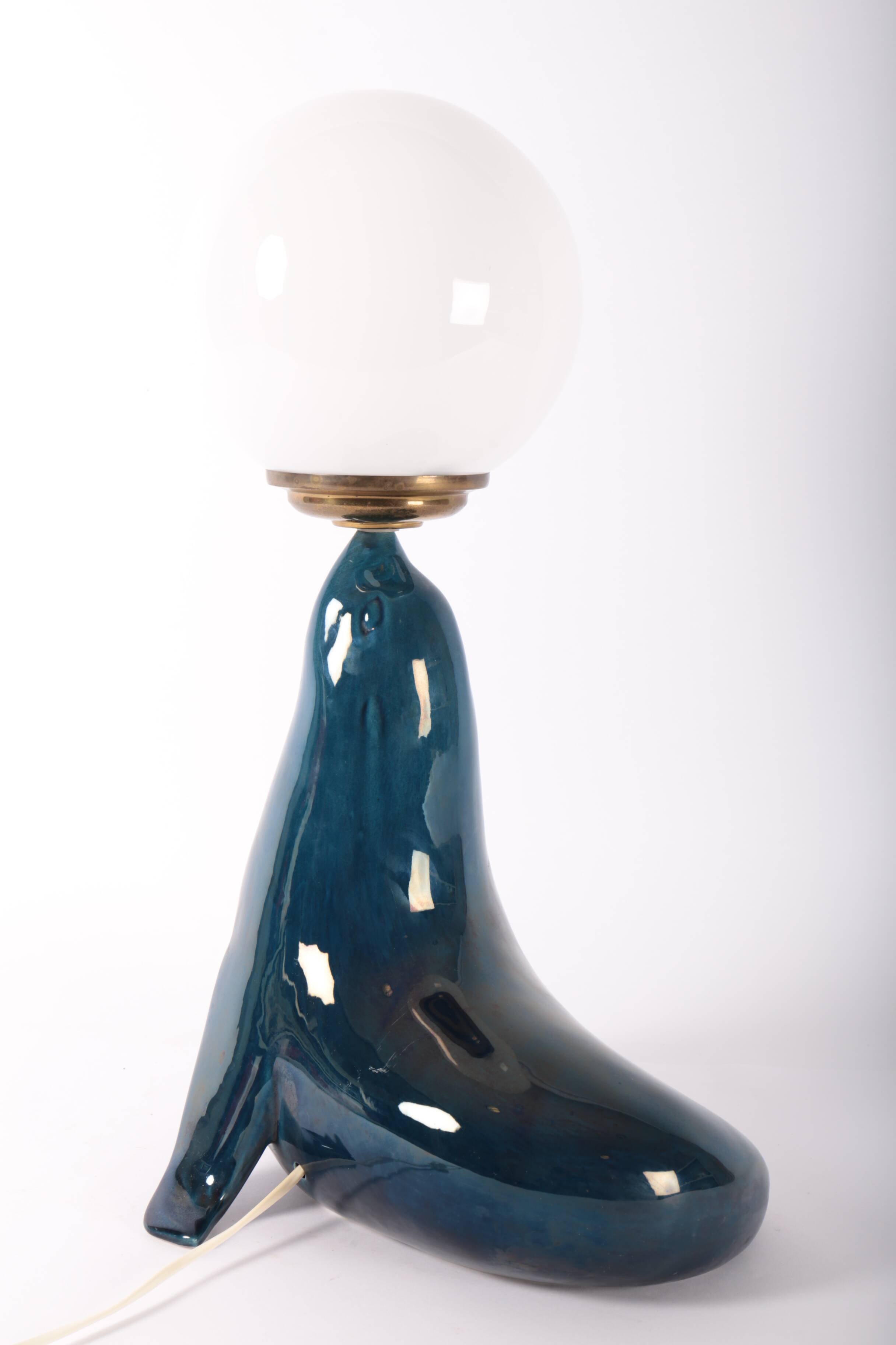 Blue ceramic sea lion lamp