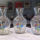 3 glass carafes, vintage. Very pretty floral pattern.