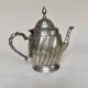 Silver-plated metal teapot with fluted body in Art Deco style