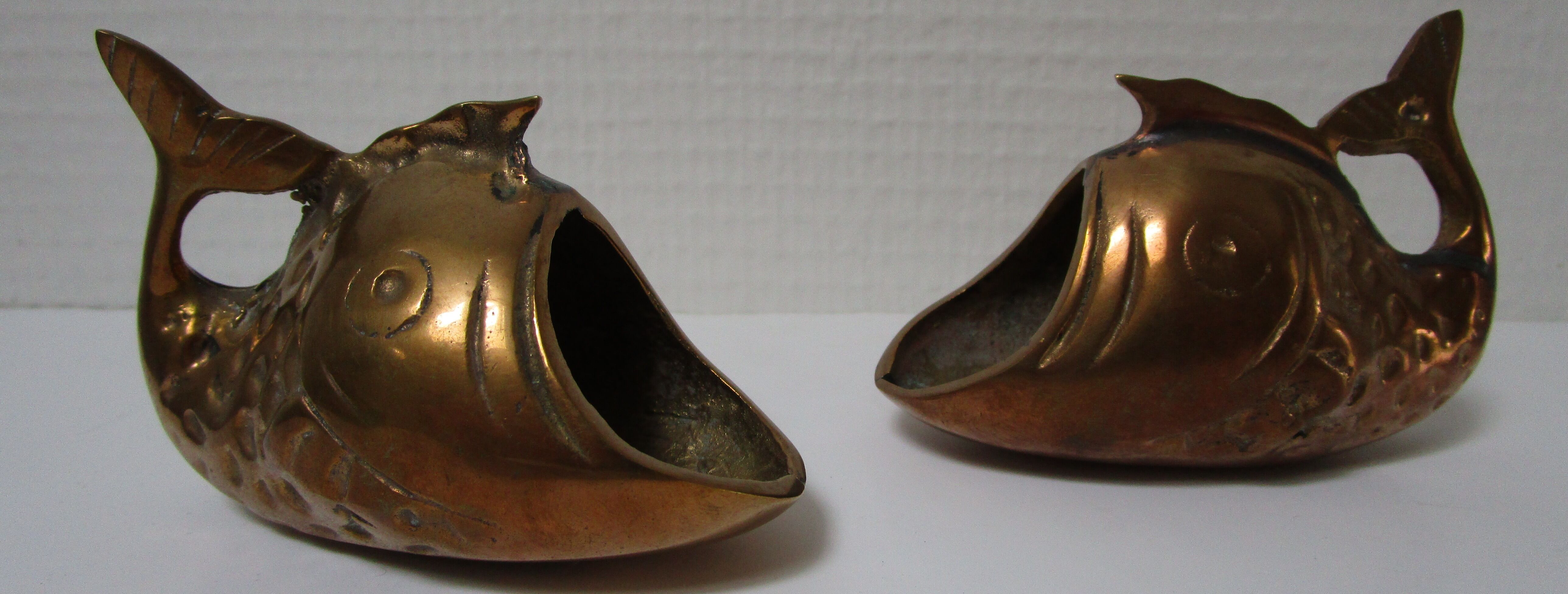 Two vintage brass fish ashtrays
