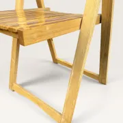 Blonde wooden folding chair in the style of Aldo Jacober.