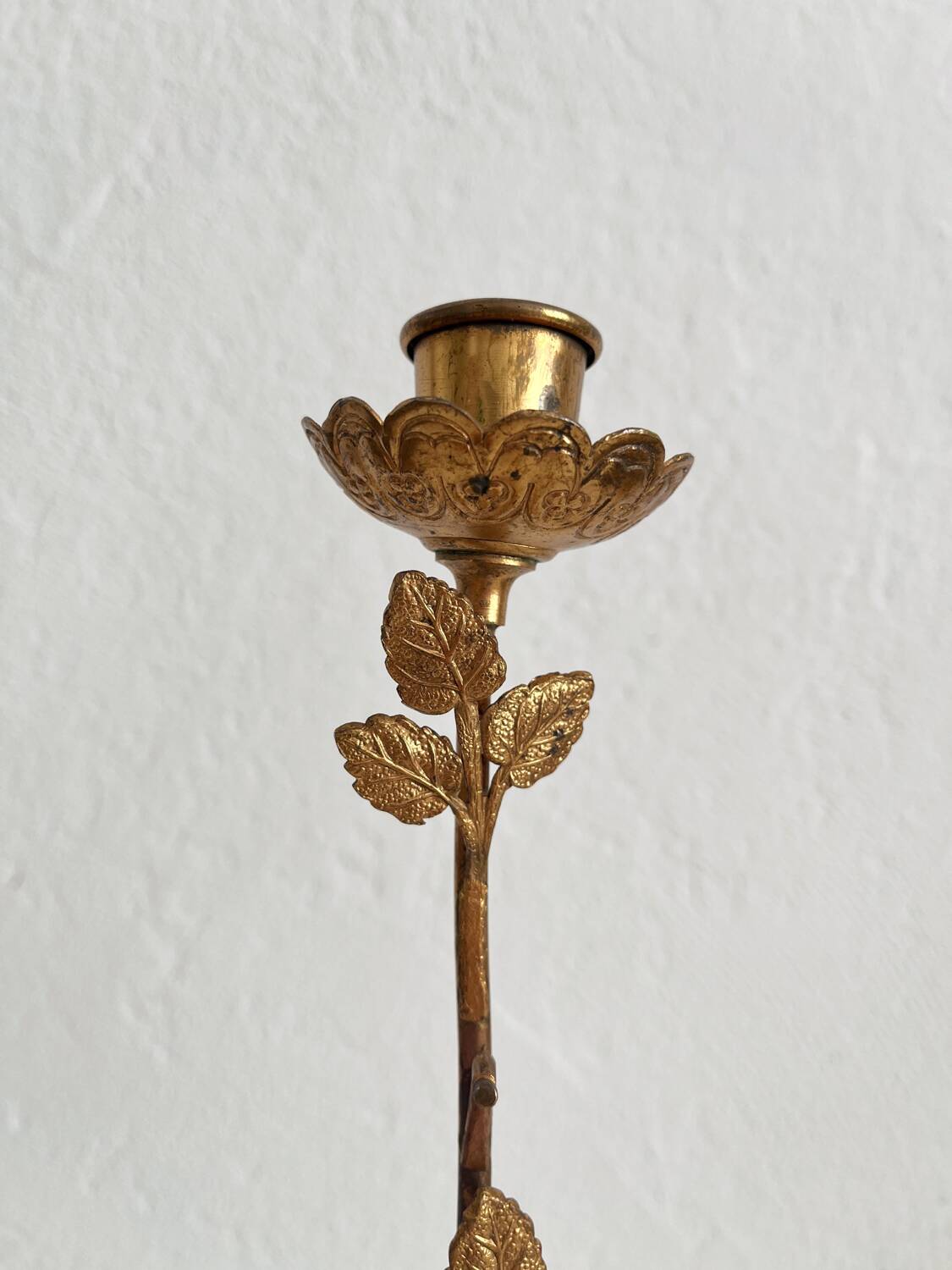 Antique bronze and brass candlestick with golden leaves