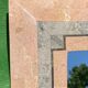 Miroir en pierre de corail rouge pavé par Maitland Smith dans les années 1970  75x110cm