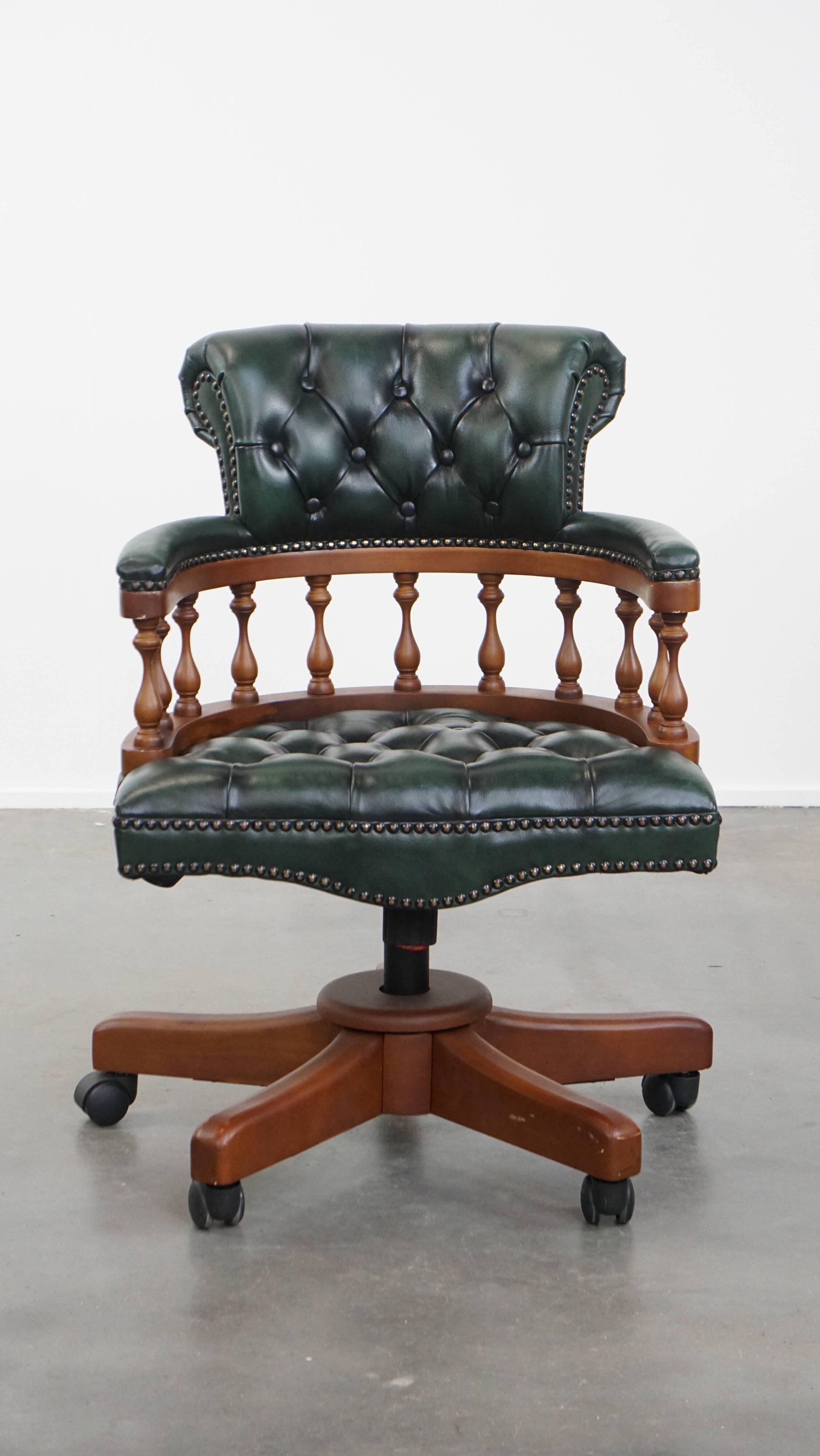 Dark green chesterfield office chair in cowhide leather on wheels