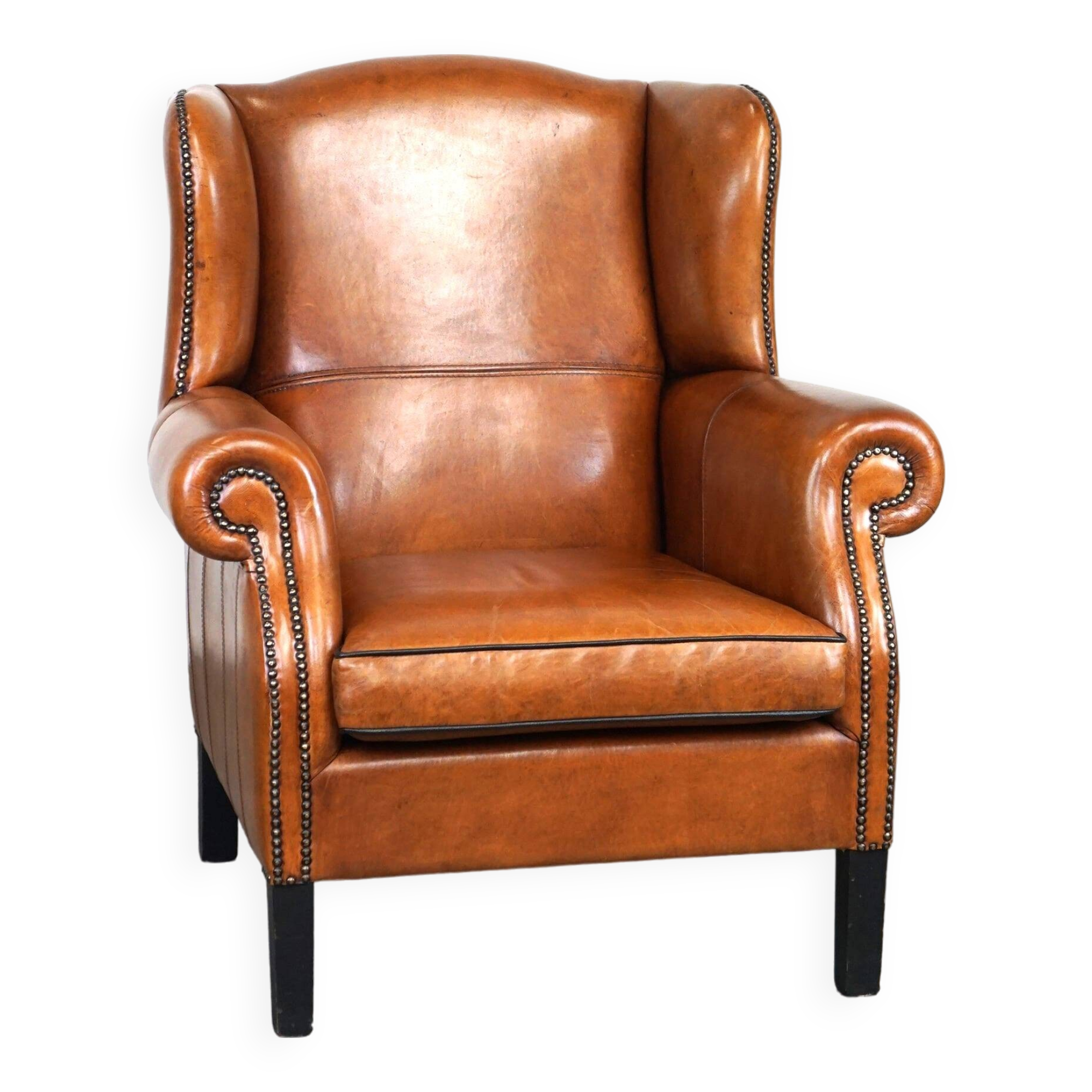 Très beau fauteuil à oreilles en cuir de mouton avec des détails époustouflants