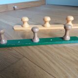 Wall-mounted coat rack with 3 mushroom-shaped hooks