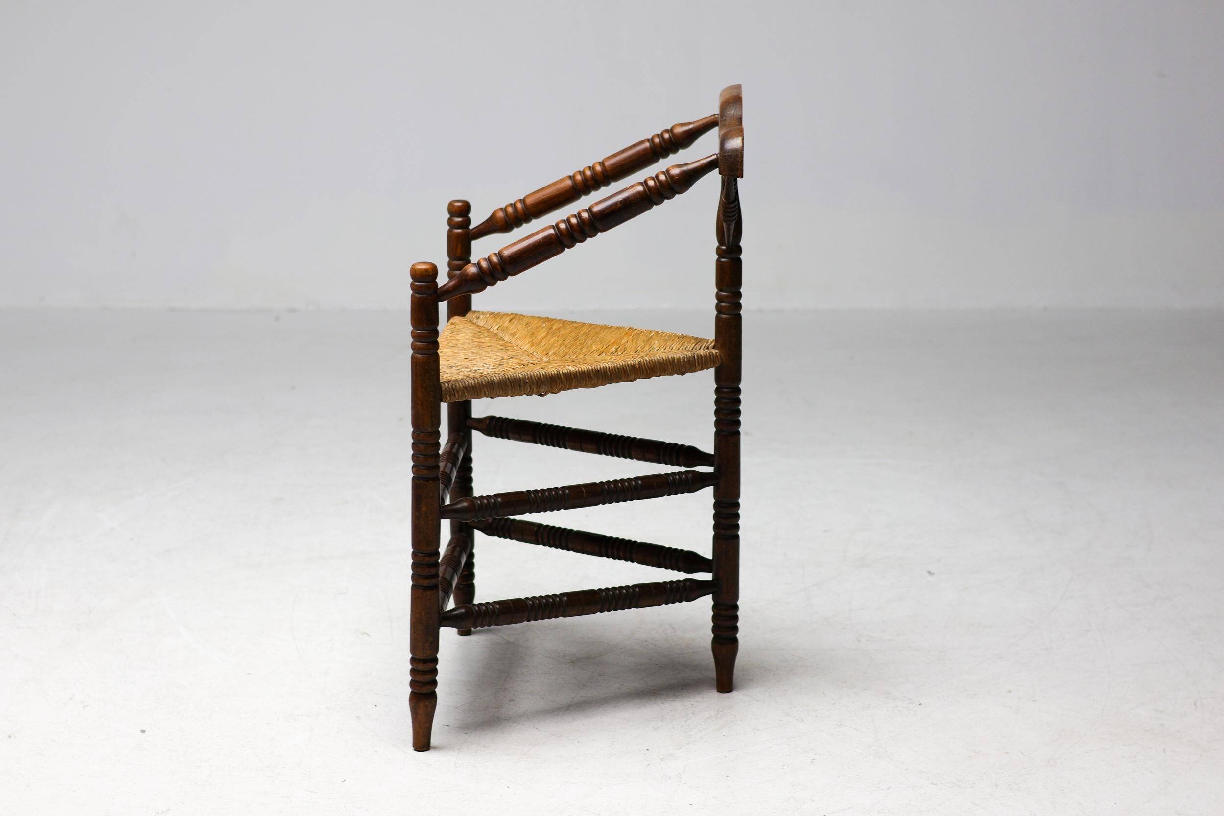 Mid Century Antiques spindle wood chaise with a rush seat.