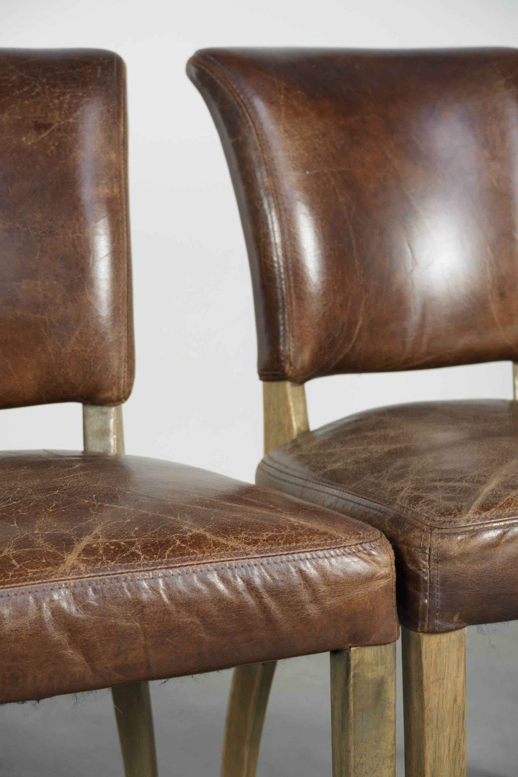 Set of 4 vintage cowhide and wooden dining chairs