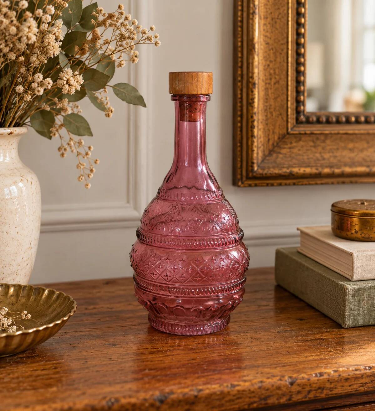 Vintage pink pressed glass carafe – retro decorative bottle with wooden stopper.