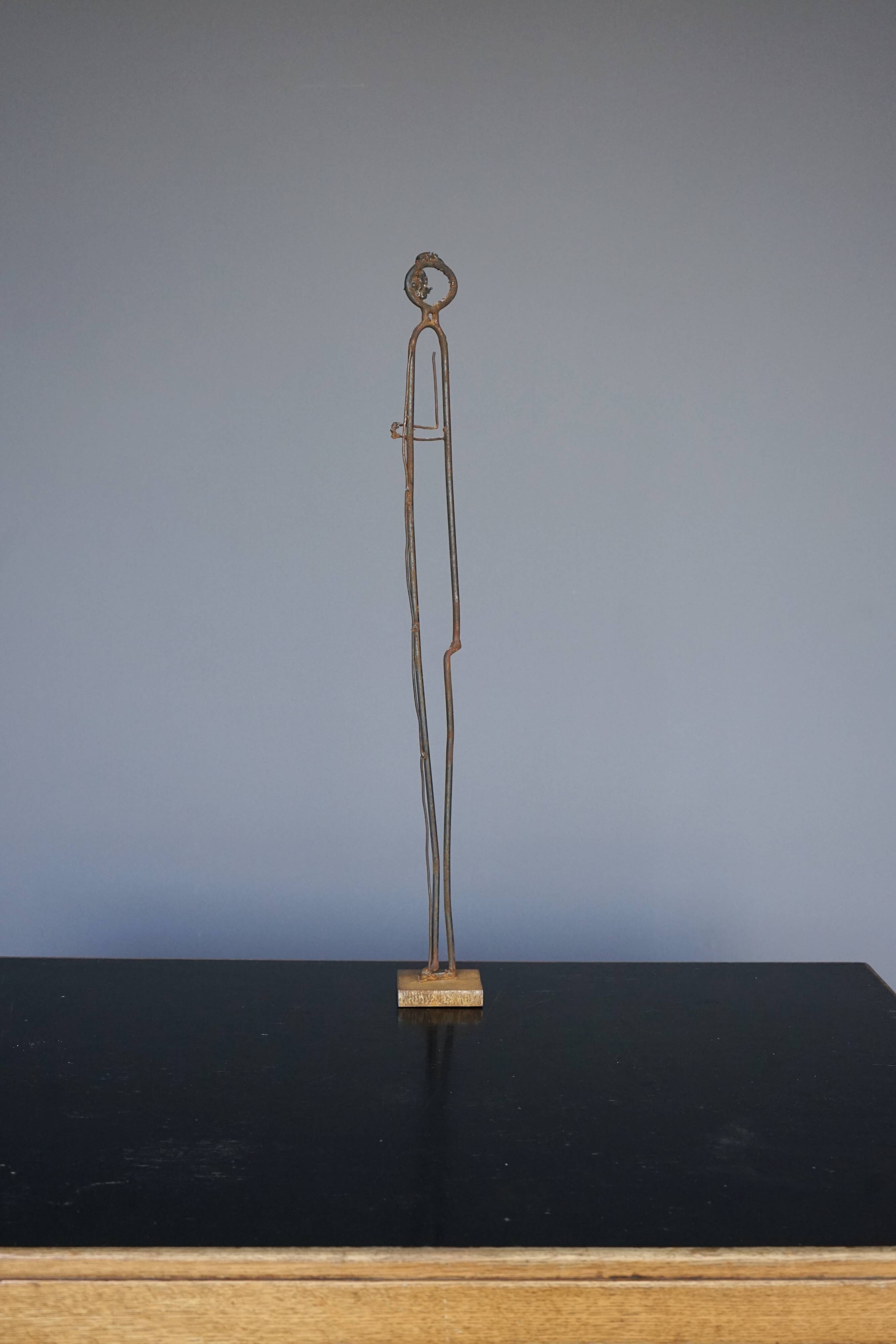 Metal Sculpture of a Standing Figure