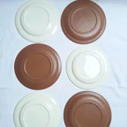 Brown flower-patterned plates from the 1970s.