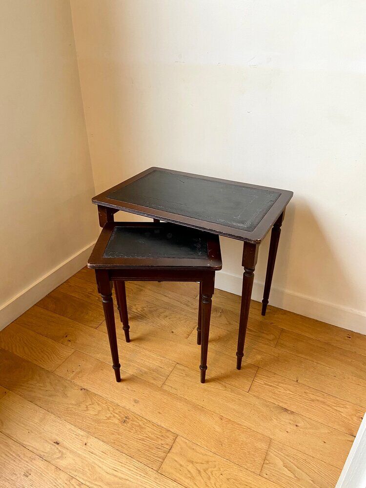 Dark wood and black leather tables