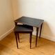 Dark wood and black leather tables