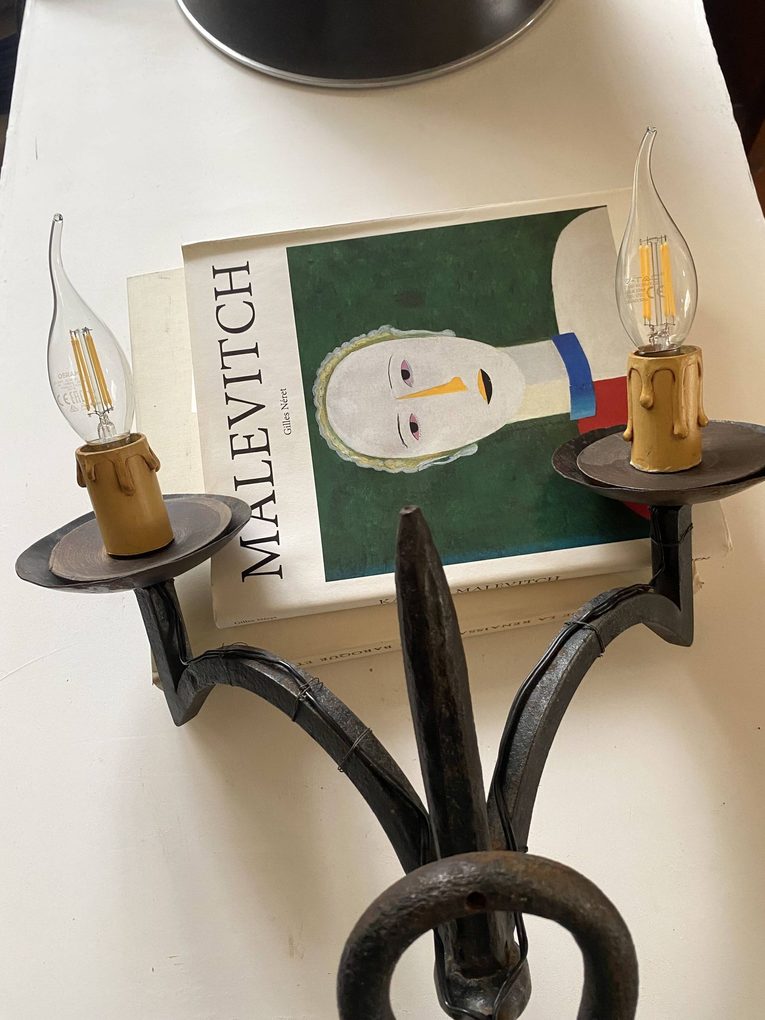 Wrought iron wall lights.