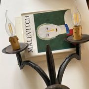 Wrought iron wall lights.
