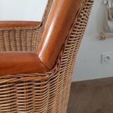 Armchair in woven rattan and exotic wood