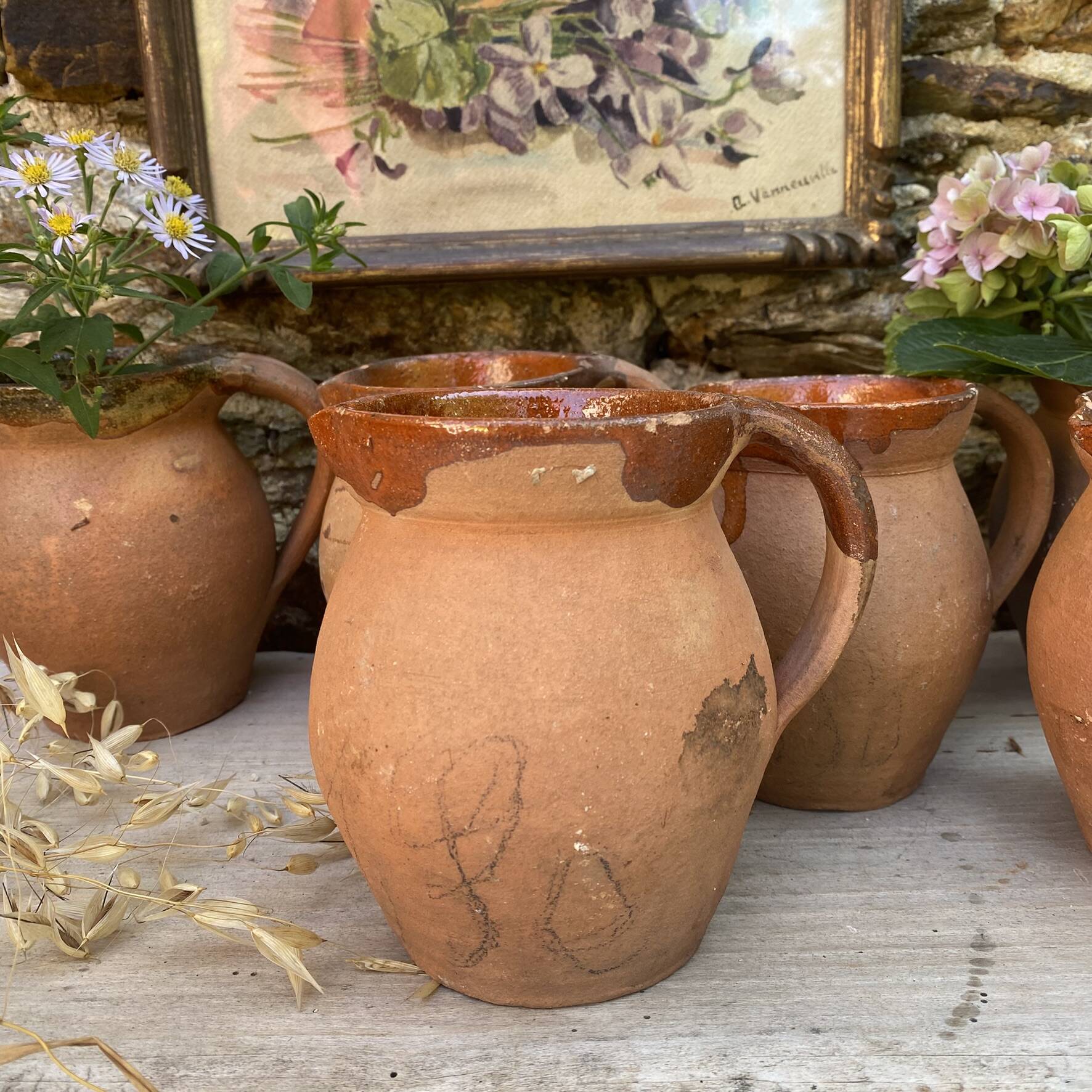 set of terracotta jugs country style