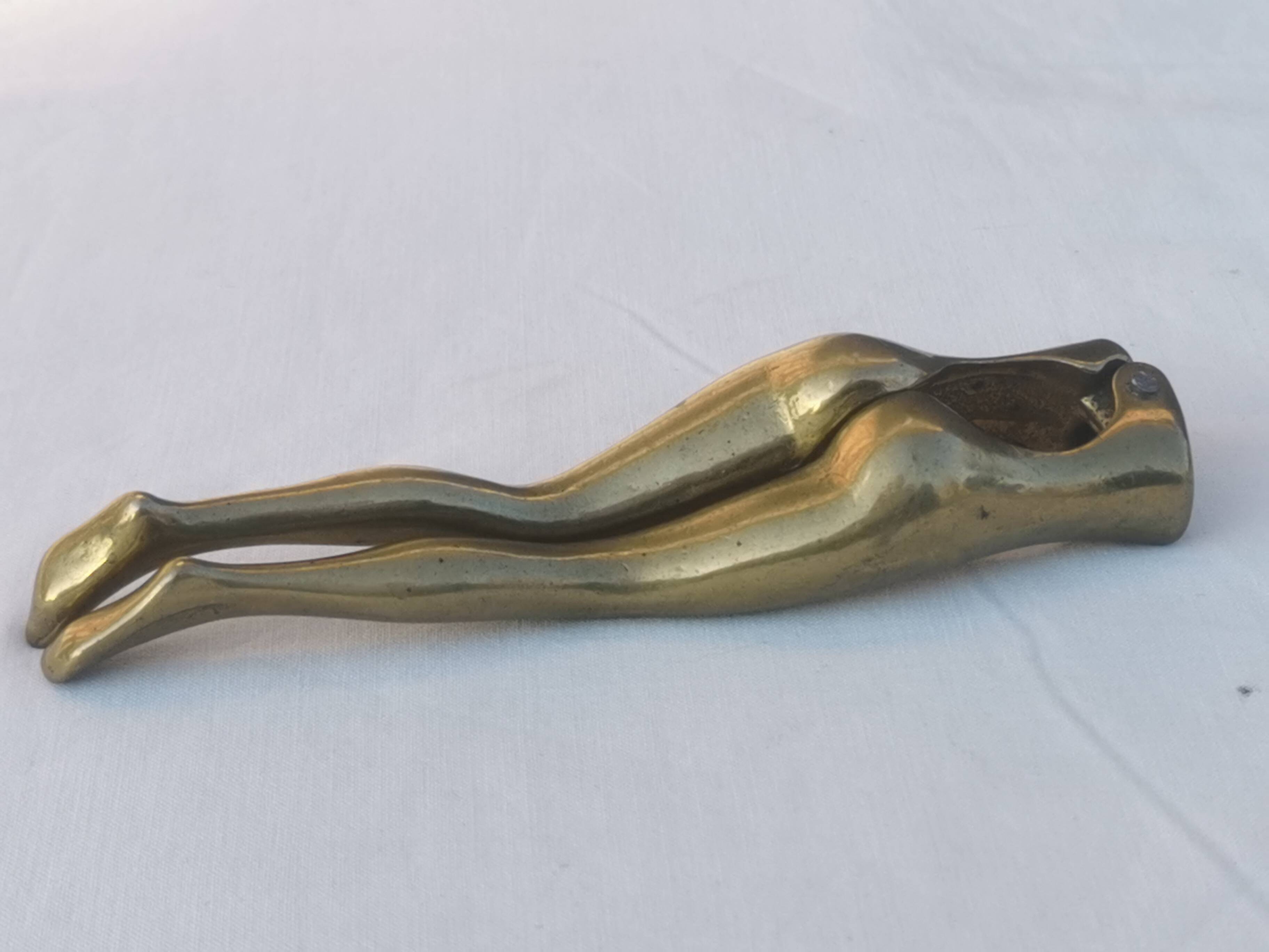 “woman’s legs” nut cracker in bronze