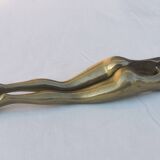 “woman’s legs” nut cracker in bronze