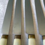 Series of 12 serrated vintage table knives
