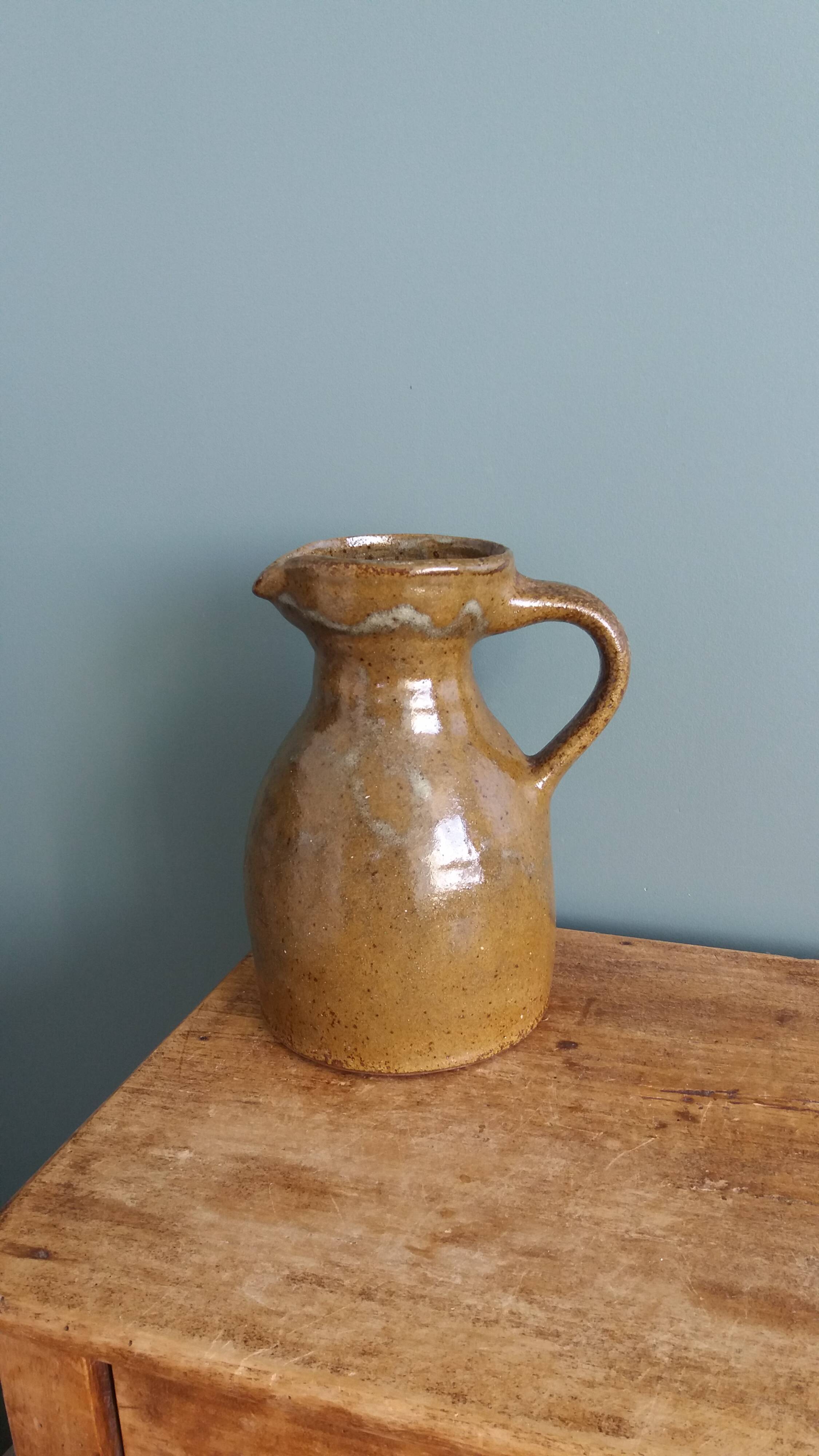 Rustic stoneware jug, chic countryside.